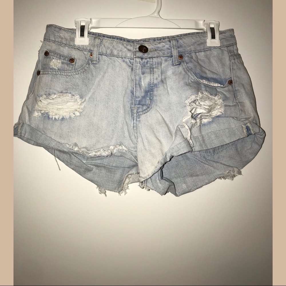 Mid rise distressed denim shorts